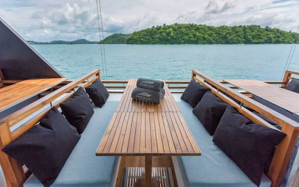 Boat deck with seating overlooking the sea near Phi Phi Island, Thailand.