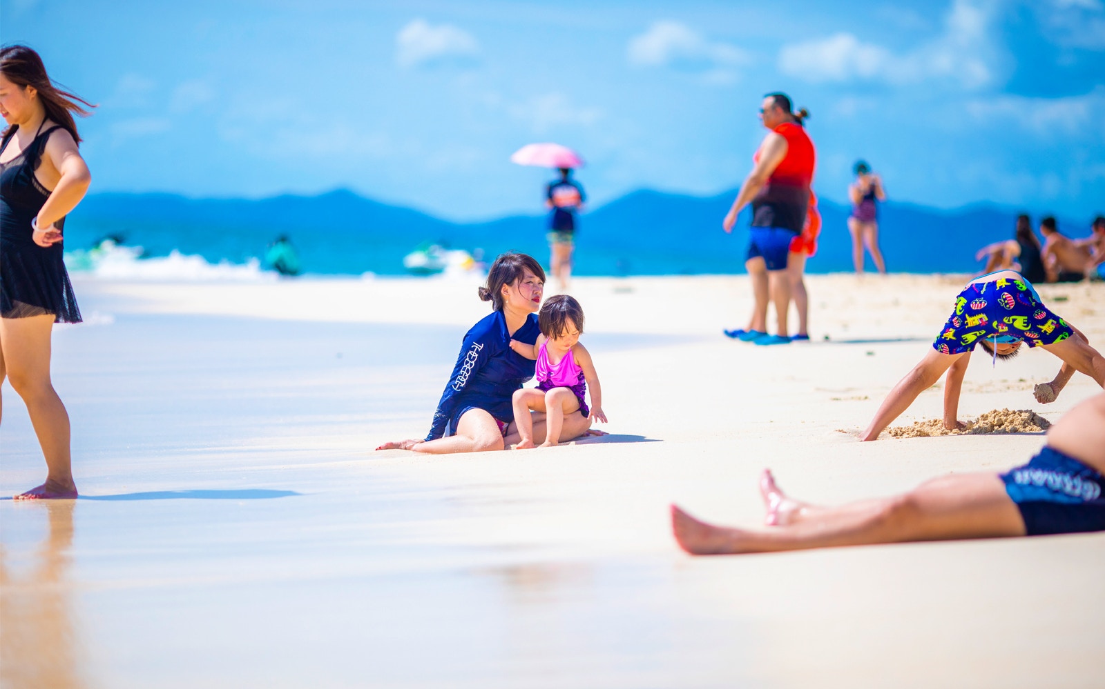 Beachgoers enjoying Khai Island, part of James Bond Island snorkeling day trip, Phang Nga.