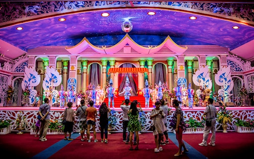 Visitors watching a colorful performance at Sukhawadee House, Pattaya.