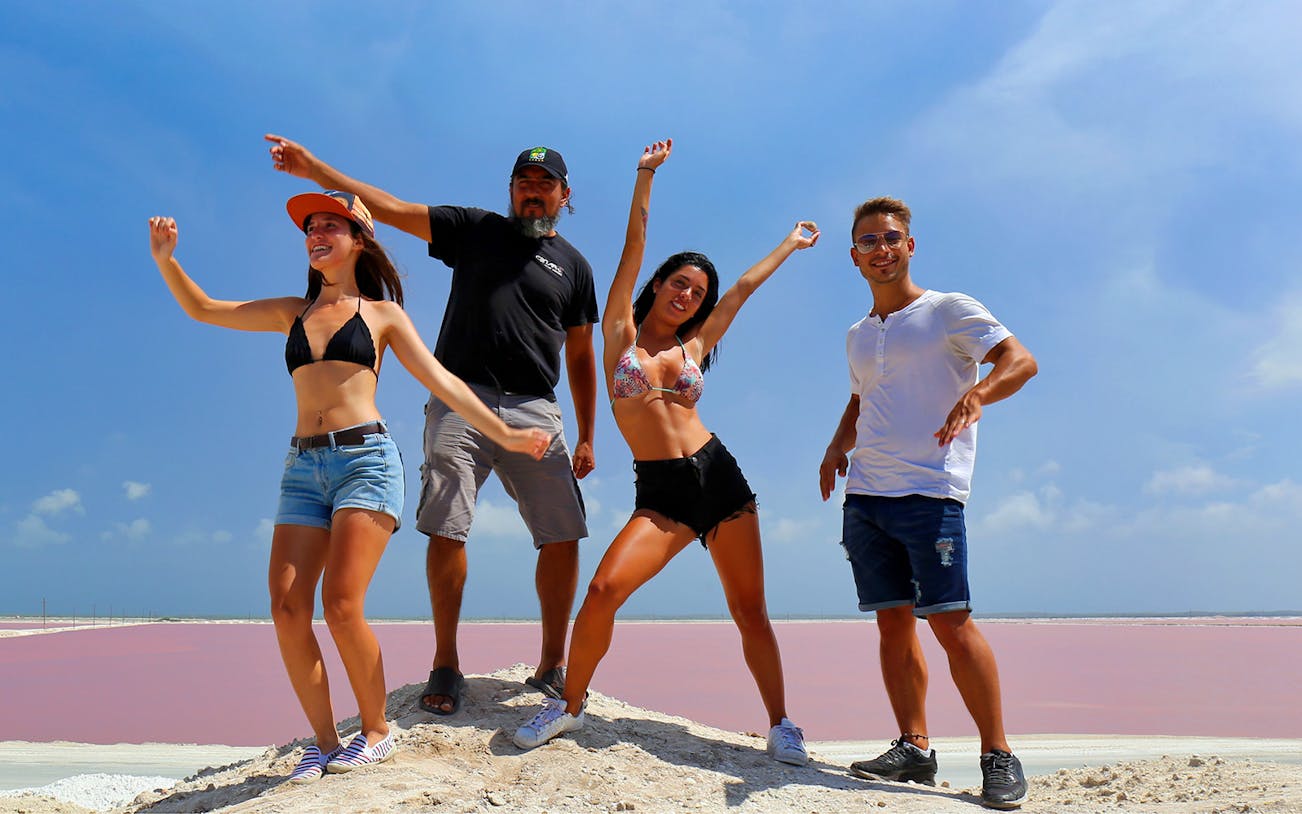 Tourists enjoying Las Coloradas' pink lakes on the Rio Lagartos tour.