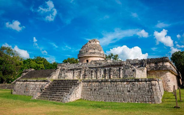 Chichén Itzá El Caracol observatory under a blue sky, part of the Chichén Itzá Basic, Hubiku Cenote & Valladolid Tour.