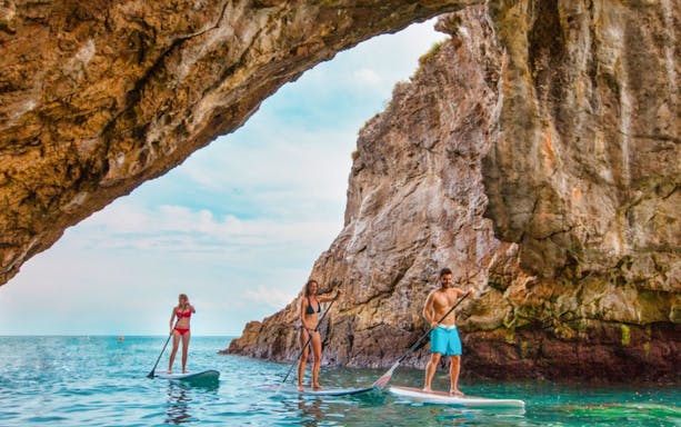 Tourists enjoying a sunny day on the all-inclusive Catamaran tour at Marietas Island with a delicious lunch served on board