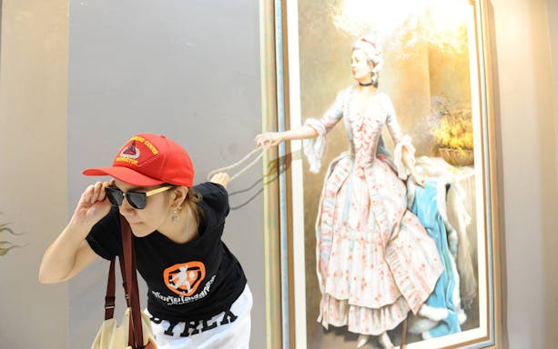 Visitor interacting with 3D painting at Art in Paradise Chiang Mai.