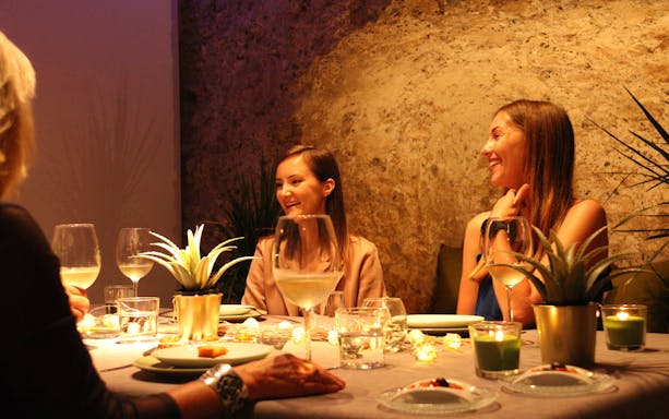 Dining experience in Valencia's 11th-century monument with wine and tapas.