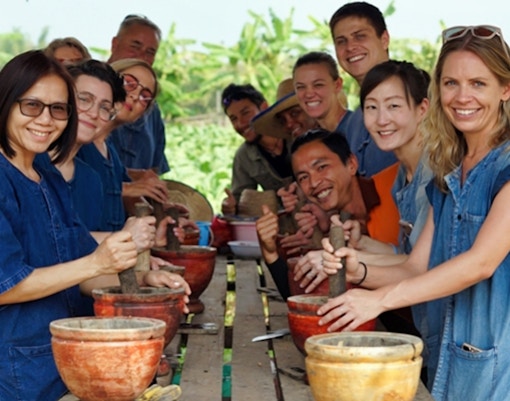 Group enjoying a cooking class at Lanna Kingdom Elephant Sanctuary, Thailand.