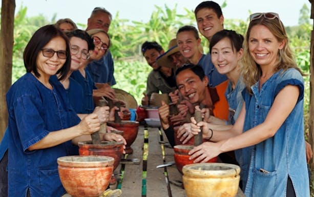 Group enjoying a cooking class at Lanna Kingdom Elephant Sanctuary, Thailand.