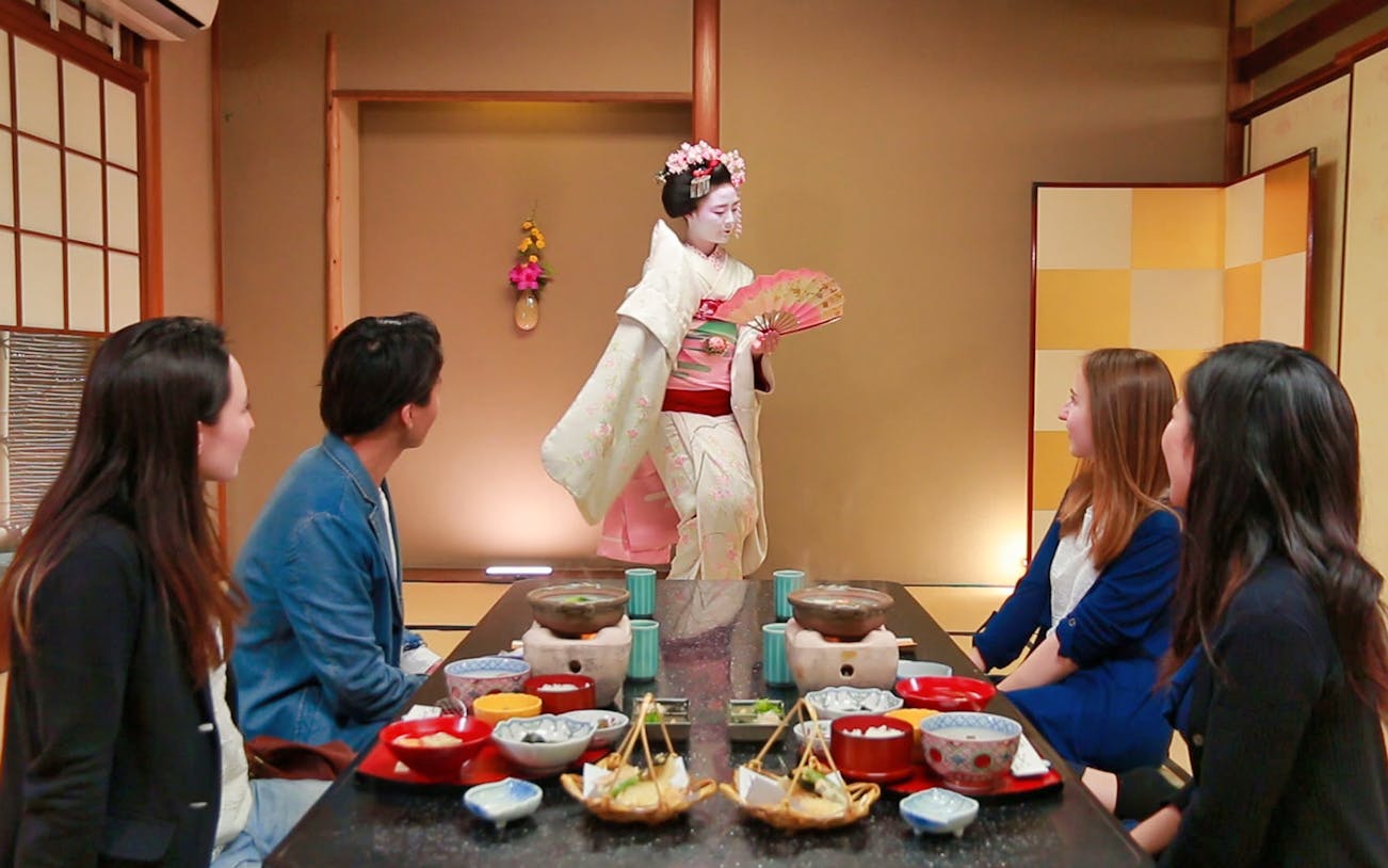 Guests watching a Maiko perform in a traditional room during the Gion and Kyoto tour.