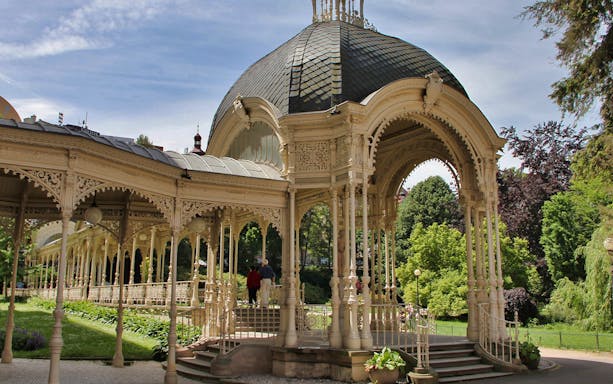 Decorative colonnade in Karlovy Vary park during a day trip from Prague.