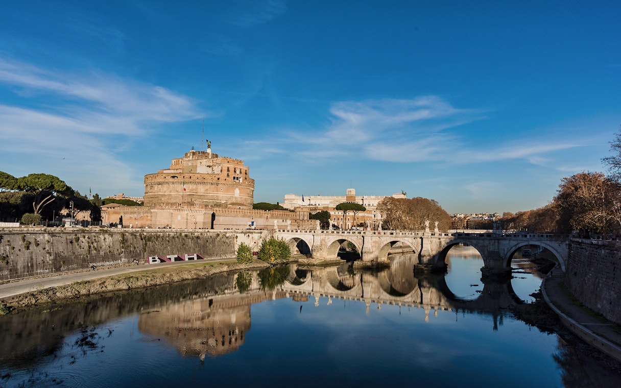 Castel Sant'Angelo and Ponte Sant'Angelo reflected in the Tiber River, Rome.