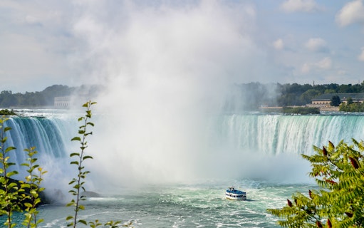 Maid of the Mist boat approaching Niagara Falls on a guided tour.