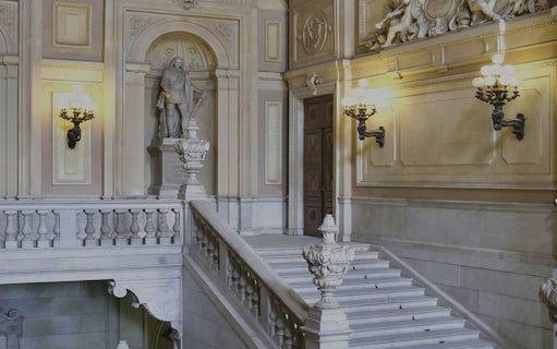 Grand staircase with statue at Royal Palace of Turin.