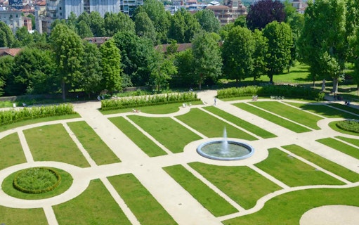 Garden view at the Royal Palace of Turin with fountain and pathways.