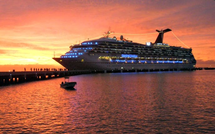 Cruise ship docked at sunset in Waikiki, Hawaii.