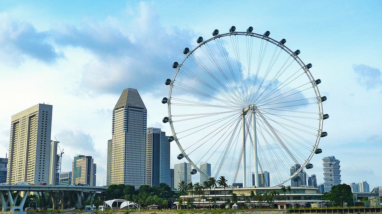 Singapore Flyer observation wheel with city skyline view.