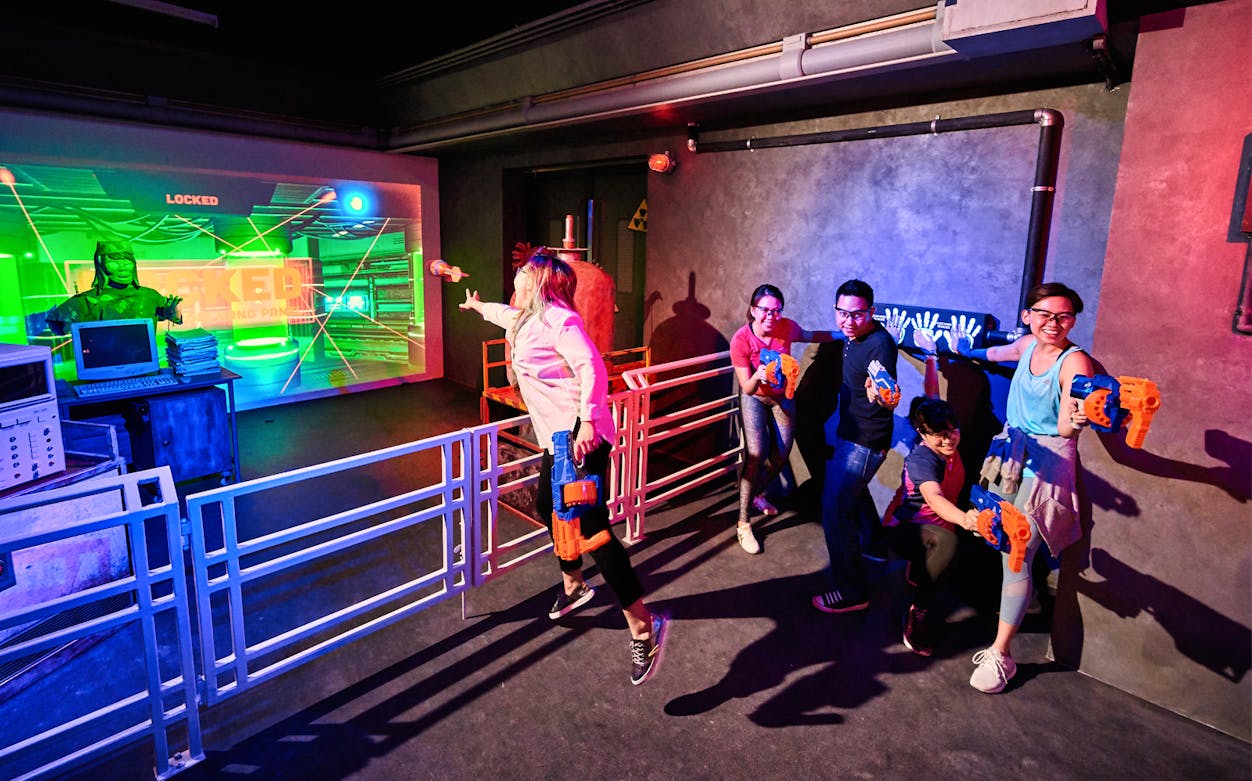 Group playing NERF battle game at Action Xperience arena.