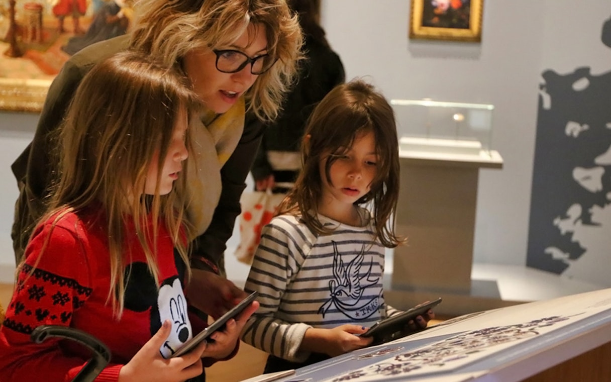 Children exploring an exhibit at Mucem with tablets, Marseille.