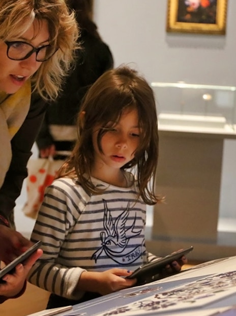 Children exploring an exhibit at Mucem with tablets, Marseille.