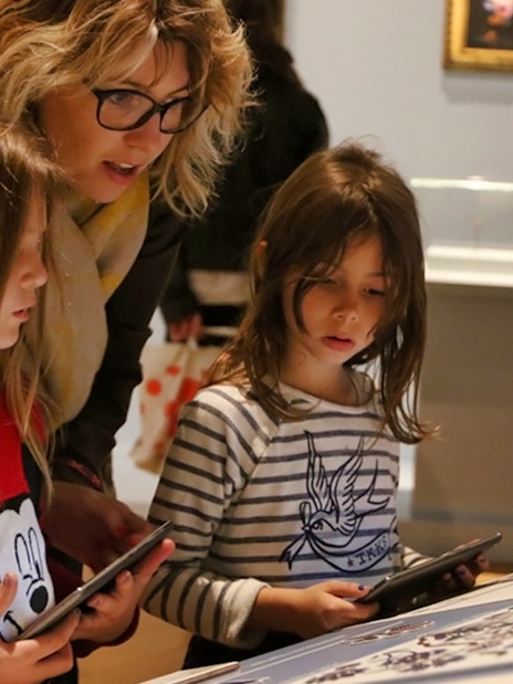 Children exploring an exhibit at Mucem with tablets, Marseille.