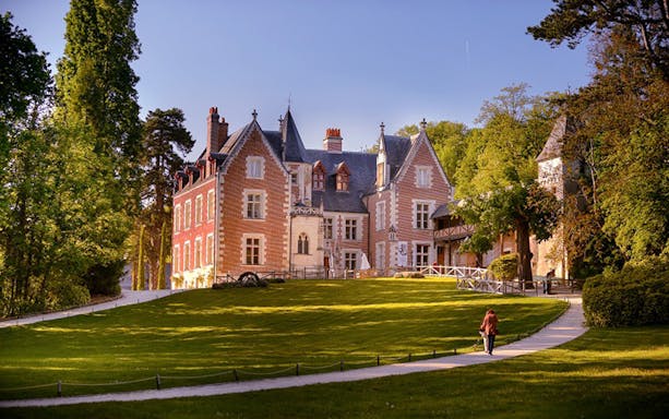 Chateau Clos Luce in Amboise, France, surrounded by lush gardens, Leonardo da Vinci's last residence.