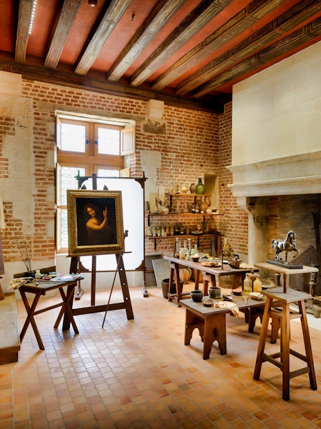 Château du Clos Lucé interior with Leonardo da Vinci's artworks and historical artifacts.