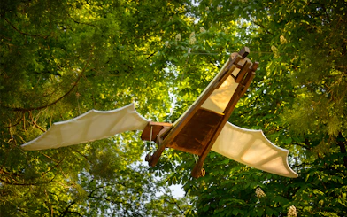 Flying machine model in trees at Clos Lucé Castle, France.