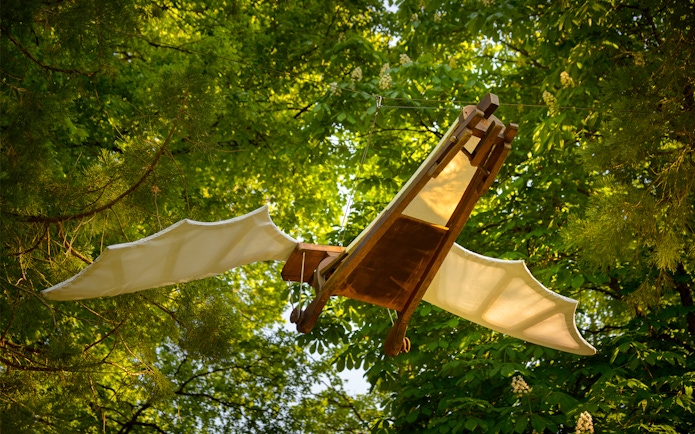 Flying machine model in trees at Clos Lucé Castle, France.