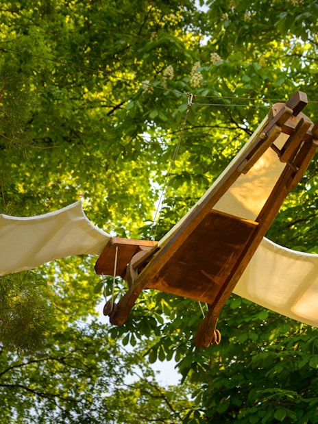 Flying machine model in trees at Clos Lucé Castle, France.