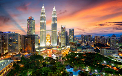 Petronas Twin Towers at sunset, Kuala Lumpur skyline, Malaysia.