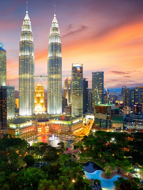 Petronas Twin Towers at sunset, Kuala Lumpur skyline, Malaysia.