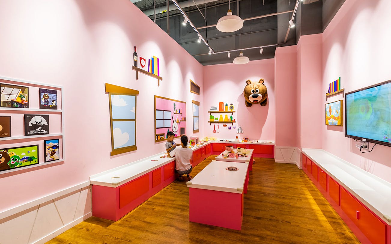 Children playing in a colorful activity room at Kiztopia Marina Square, Singapore.