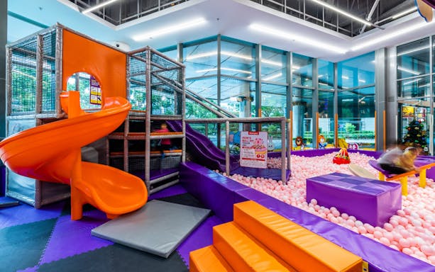Indoor playground with slides and ball pit at Kiztopia Marina Square, Singapore.