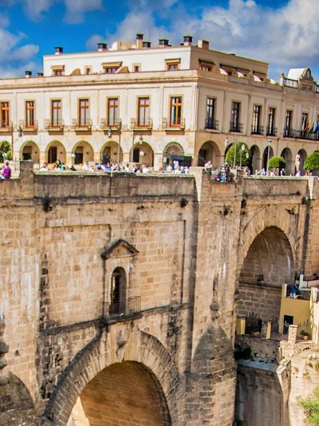 Ronda's Puente Nuevo bridge with surrounding buildings on a day trip from Málaga.