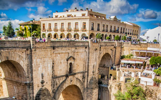 Ronda's Puente Nuevo bridge with surrounding buildings on a day trip from Málaga.