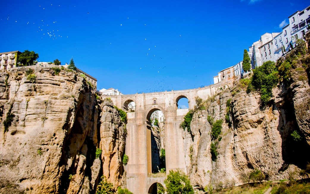 Ronda's Puente Nuevo bridge spanning a deep gorge, seen on a day trip from Málaga.