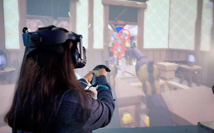 Person playing virtual reality game at HeadRock VR Singapore.