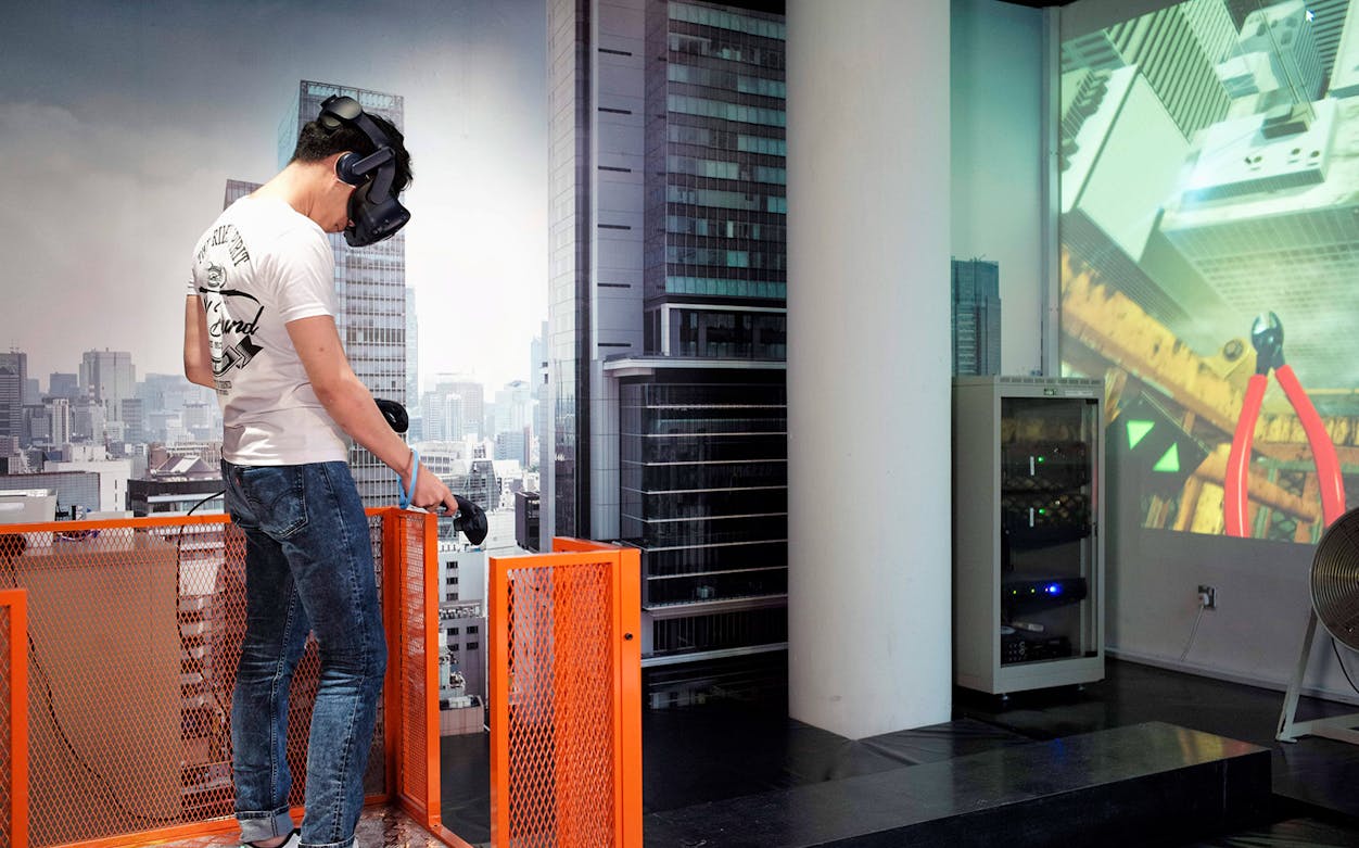 Person experiencing virtual reality at HeadRock VR Singapore.