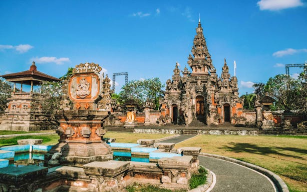Denpasar Bali temple with intricate carvings and traditional architecture.