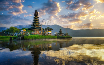 Ulun Danu Bratan Temple reflecting on the lake at sunrise, Bali.