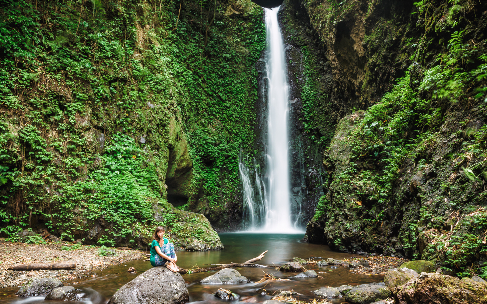 Sekumpul Waterfall with lush greenery, part of the Ulun Danu Bratan and Taman Ayun Temple tour.