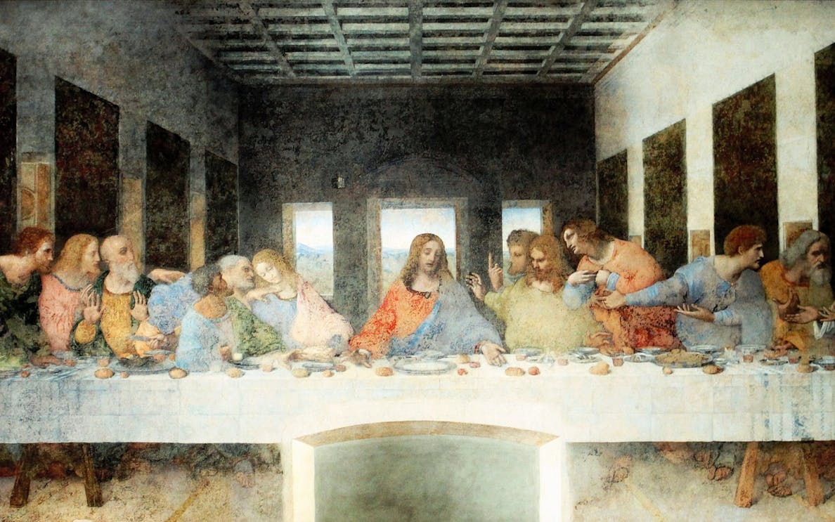 Da Vinci's Last Supper mural in Milan, Italy, depicting Jesus and disciples at a long table.