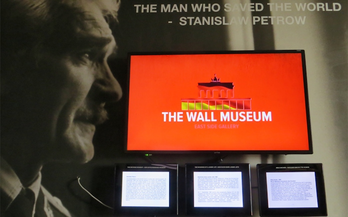 The Wall Museum East Side Gallery exhibit featuring Stanislav Petrov display.