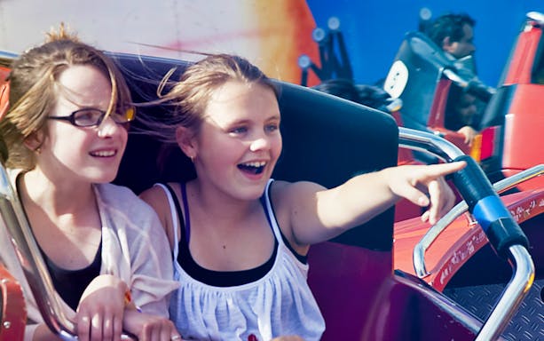 Children enjoying a ride at Luna Park Sydney.