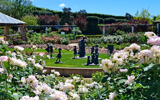 Hunter Valley Gardens with sculptures and blooming flowers in a vibrant landscape.