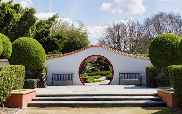 Circular entrance with benches at Hunter Valley Gardens, Australia.