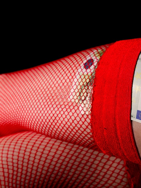 Red fishnet stockings with euro bills tucked in, St. Pauli Sex & Crime Tour.