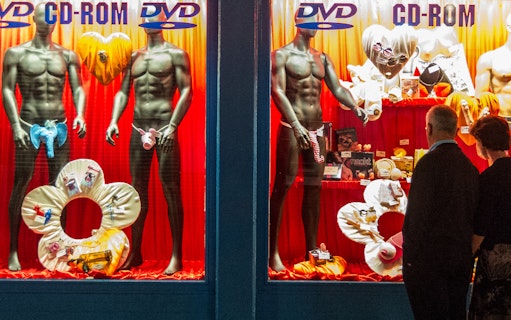 Storefront display with mannequins in lingerie, St. Pauli, Hamburg, for adult tour.