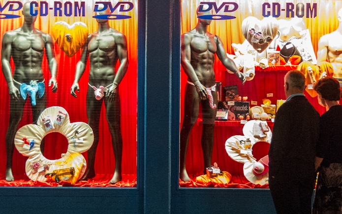 Storefront display with mannequins in lingerie, St. Pauli, Hamburg, for adult tour.
