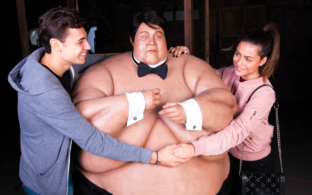 Visitors interacting with a wax figure at Ripley's Believe It or Not!