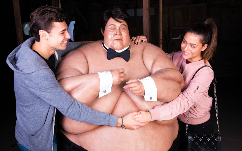 Visitors interacting with a wax figure at Ripley's Believe It or Not!