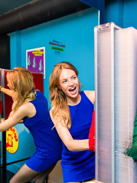 Visitors interacting with a pin art display at Ripley's Believe It or Not!